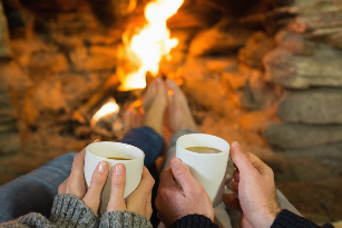 a couple in front of the fire